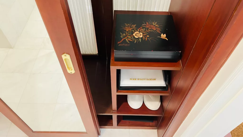 Park Hyatt Saigon closet with slippers, laundry bag